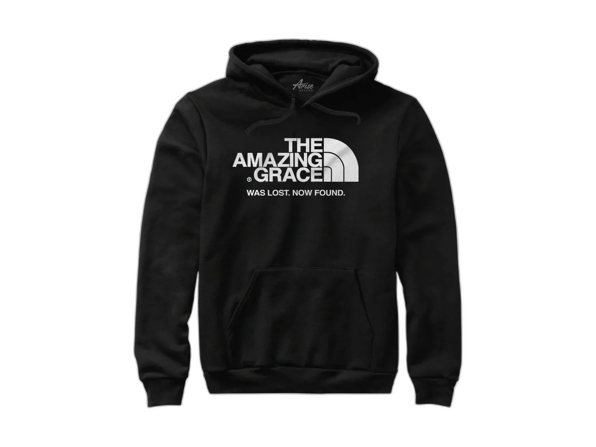 Black Arise Apparel Amazing Grace Christian hoodie with its printed message visible, isolated on a transparent background.