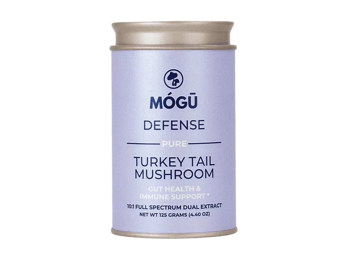 Mógū Defense Organic Turkey Tail powder container, front view, isolated on a transparent background