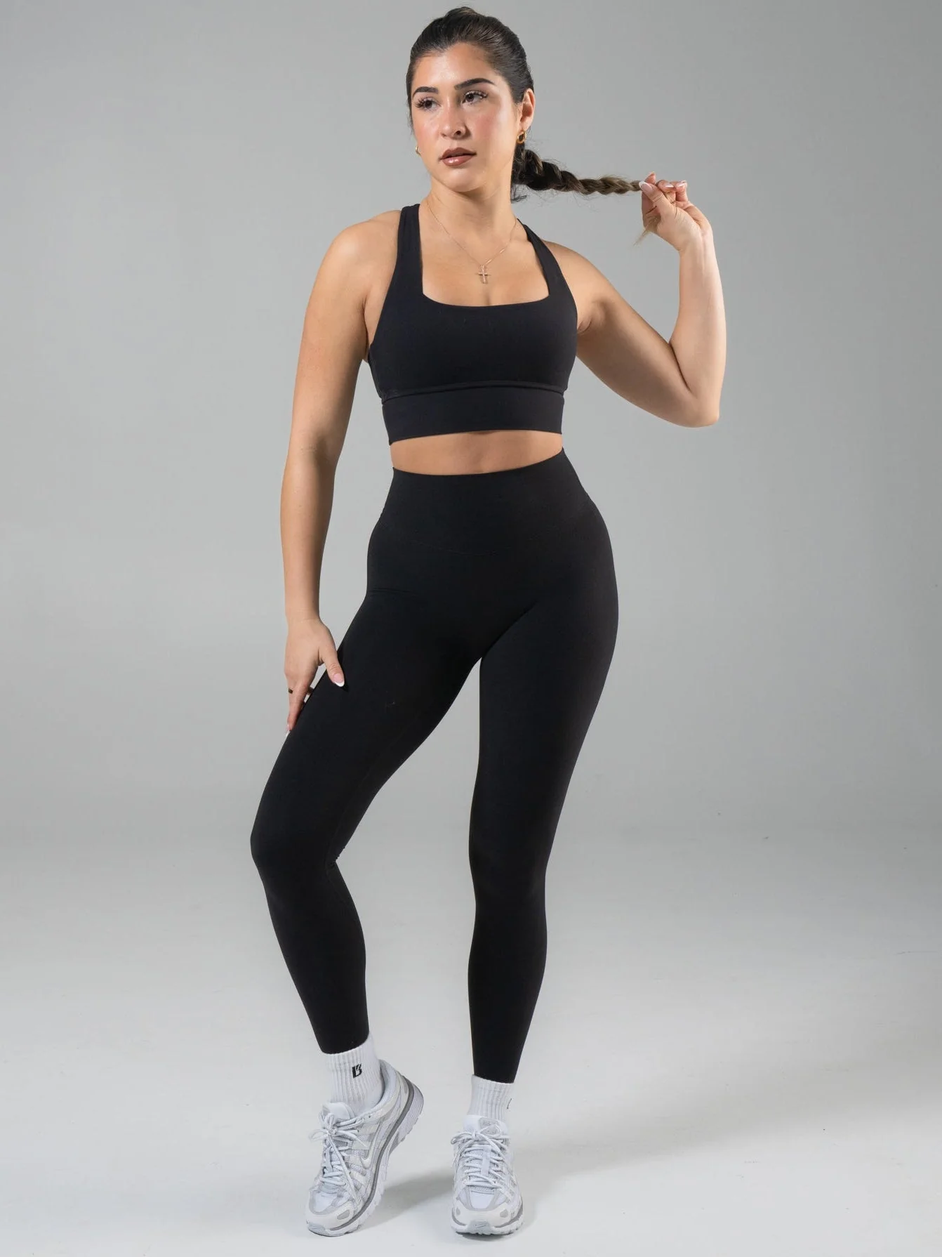 Model wearing black Buffbunny Micro Legacy leggings in official product photography.