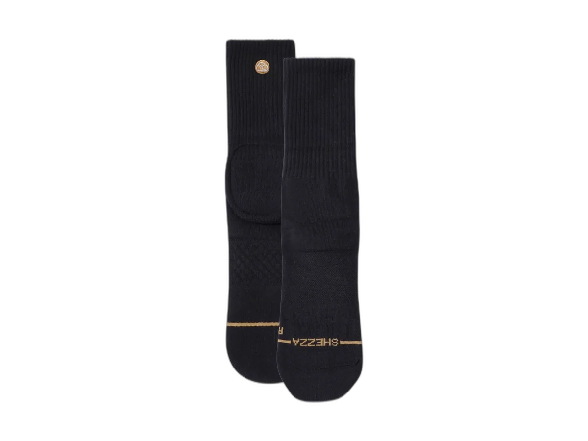 Pair of black Shezza Padded Crew Socks with reinforced foam heel padding isolated on a transparent background
